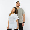 A male and female wearing organic cotton t-shirts in white and light grey colours with a geometric minimalistic print in the front