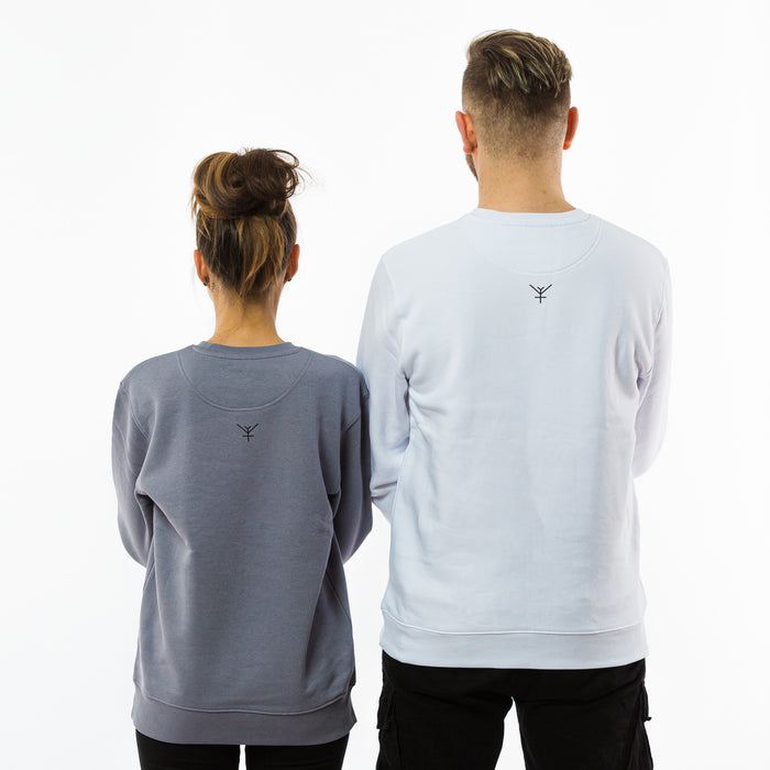 A man and a woman showing a back of the organic cotton sweatshirts with a yulunga brand logo printed in between the shoulders.