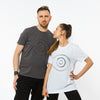 A male and female wearing grey and white t-shirts with an artistic hand drawn style image of an eye in the front made of organic cotton