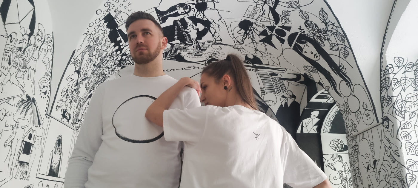 A male and female wearing white Yulunga brand organic cotton clothing