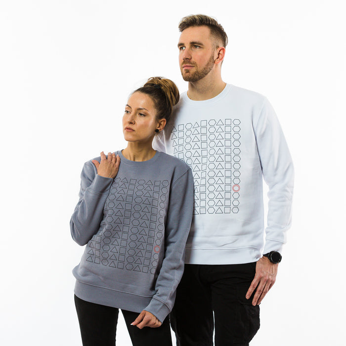 A woman and a man wearing sweatshirts with a geometric simple print, made of organic cotton in grey and white colours