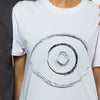 A wite t-shirt with an image of an eye in black ink in the front