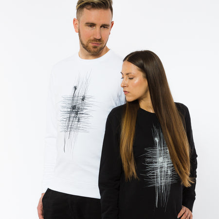 A female and a male wearing black and white sweatshirts with an abstract grungy print in the front. The sweatshirts are by Yulunga conscious brand.