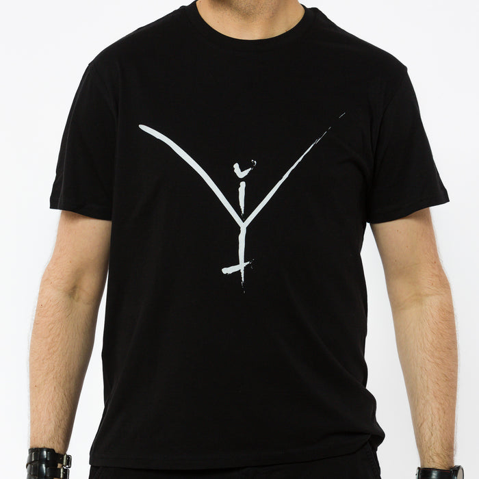 A black organic cotton unisex t-shirt with a white artistic Yulunga brand logo print