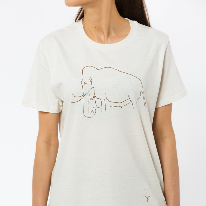 A female model wearing a cream minimalistic t-shirt with a delicate light brown mammoth print and a little Yulunga brand logo on the front.