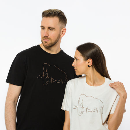 A male and a female wearing organic cotton t-shirts, one in black and another in cream colour with an image of a mammoth on the front.