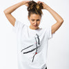 A female wearing a white t-shirt made of organic cotton  with an artistic Japanese style print in black, red and grey.